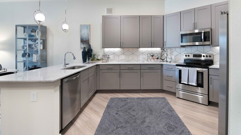 Spacious kitchen with quartz countertops and custom cabinetry