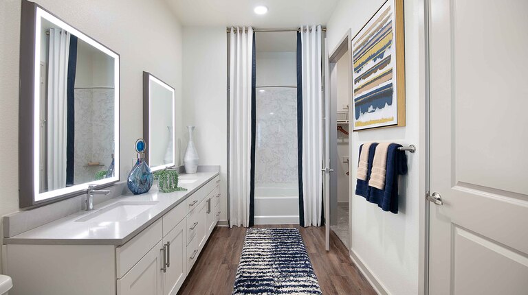 Primary bathroom with double vanity and soaking tub