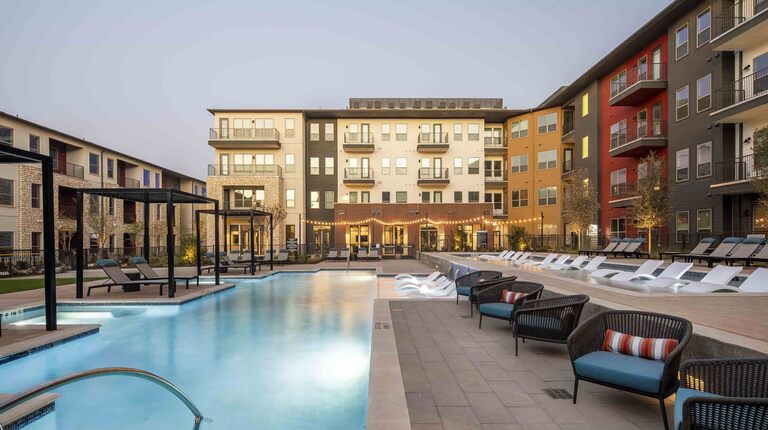 Luxurious two-tiered pool with poolside cabanas