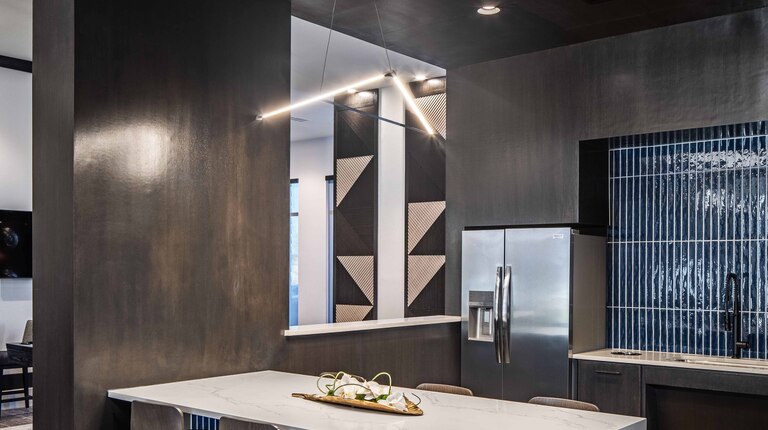 Resident lounge with gathering spaces and kitchen